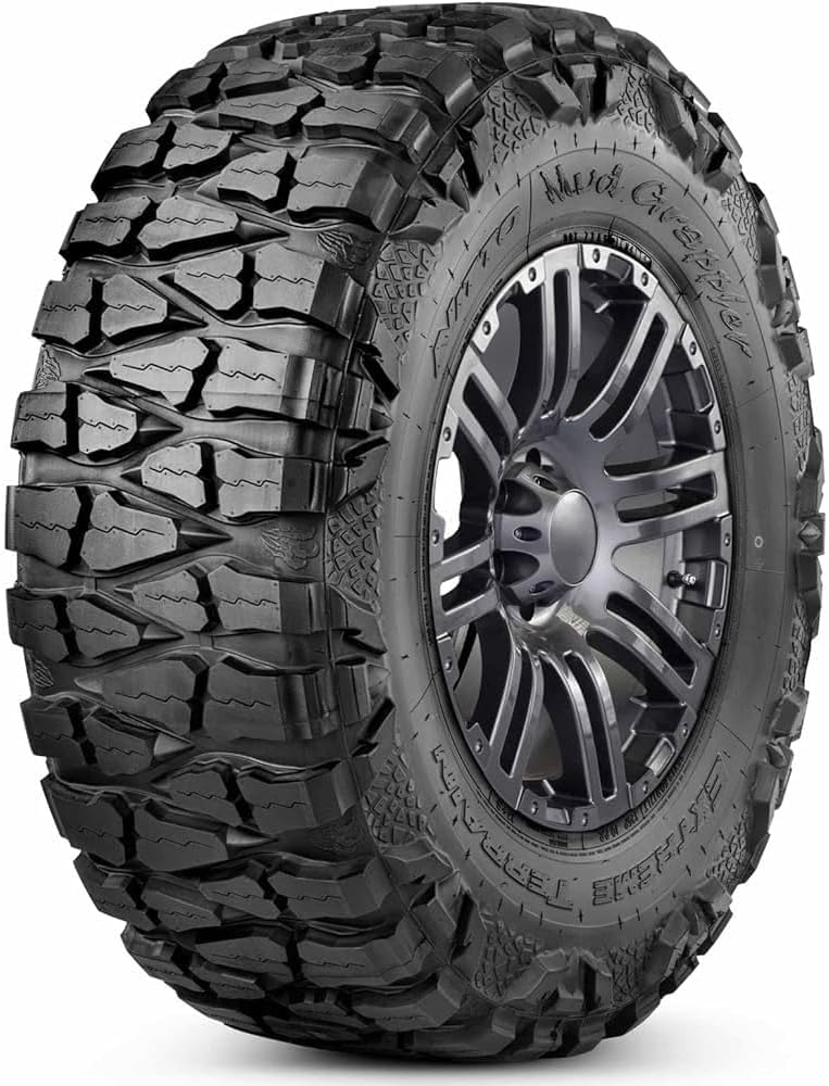 Nitto Mud Grappler extreme mud-terrain tire, deep tread blocks wrapping onto the sidewall